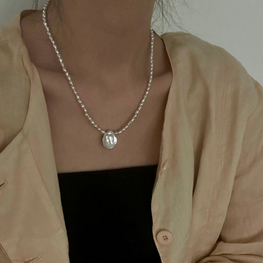 Pure Bloom: Minimalist Seed Pearl Choker with Petal Pendant