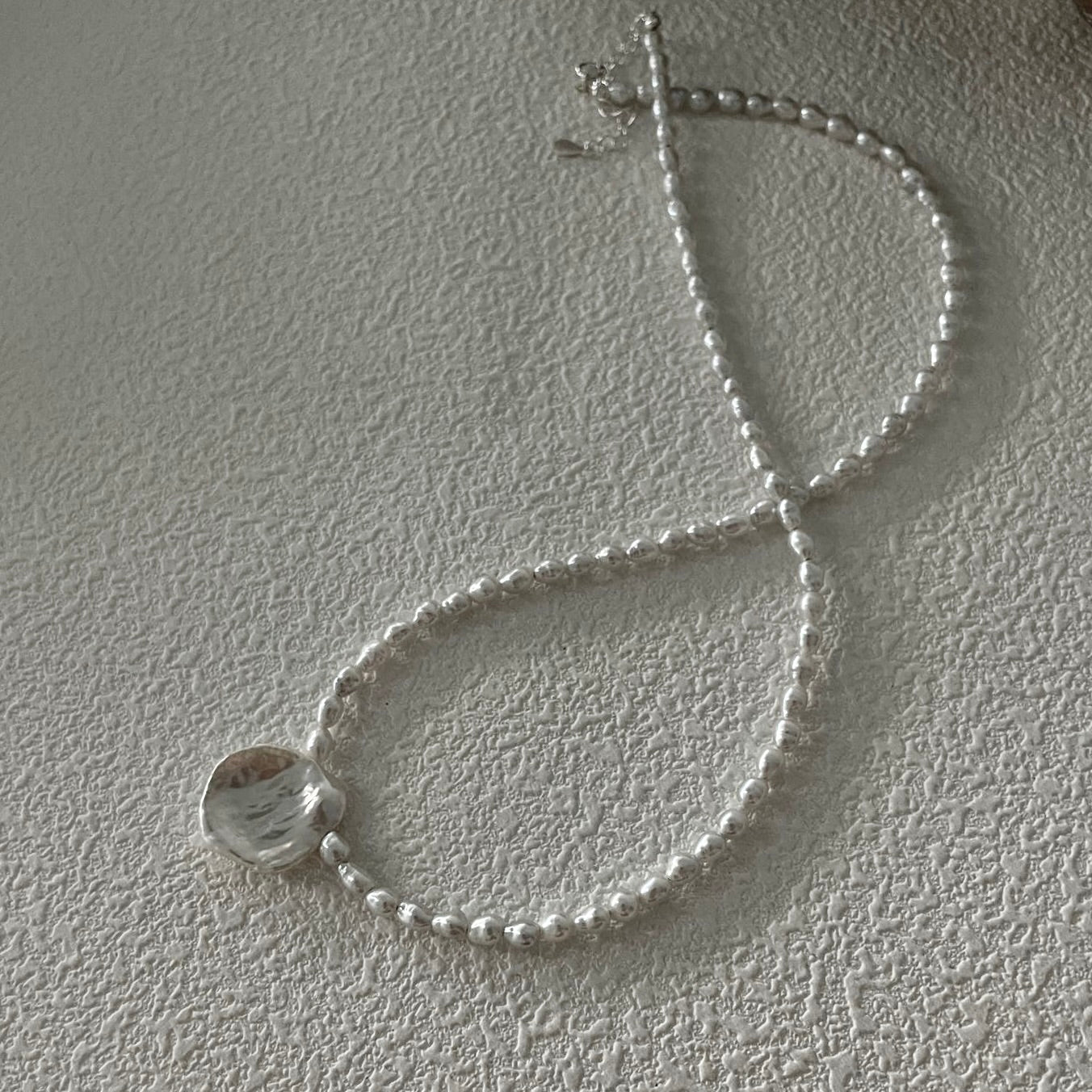 Pure Bloom: Minimalist Seed Pearl Choker with Petal Pendant