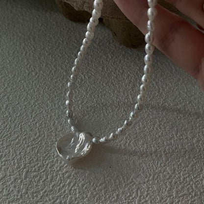 Pure Bloom: Minimalist Seed Pearl Choker with Petal Pendant