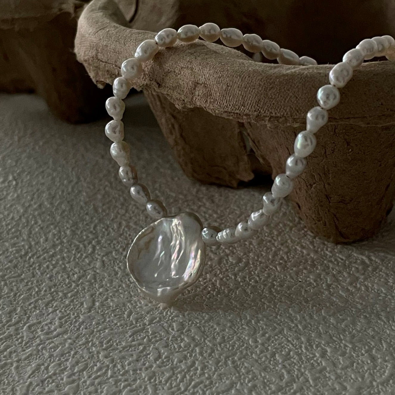 Pure Bloom: Minimalist Seed Pearl Choker with Petal Pendant