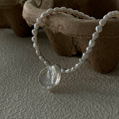 Pure Bloom: Minimalist Seed Pearl Choker with Petal Pendant